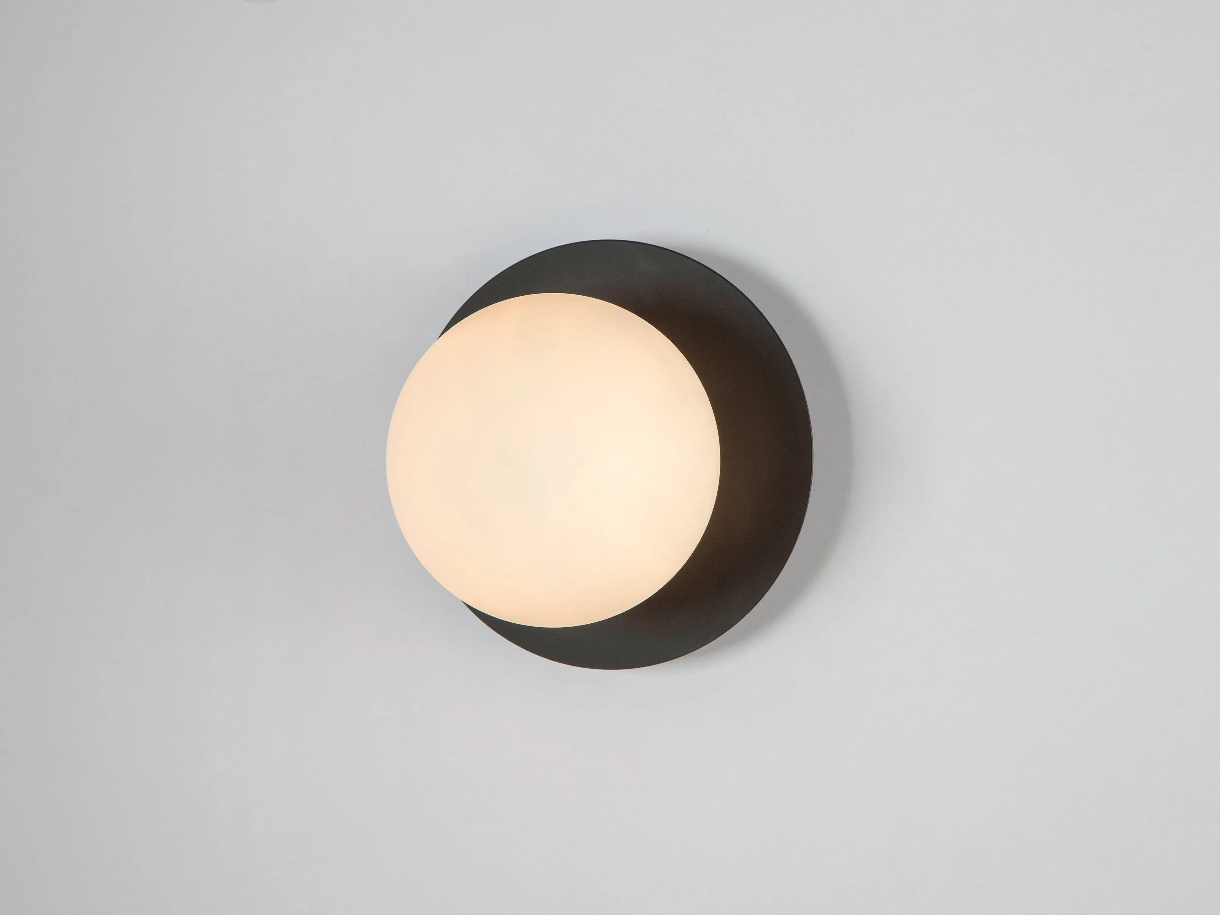 Charcoal grey opal disk wall light